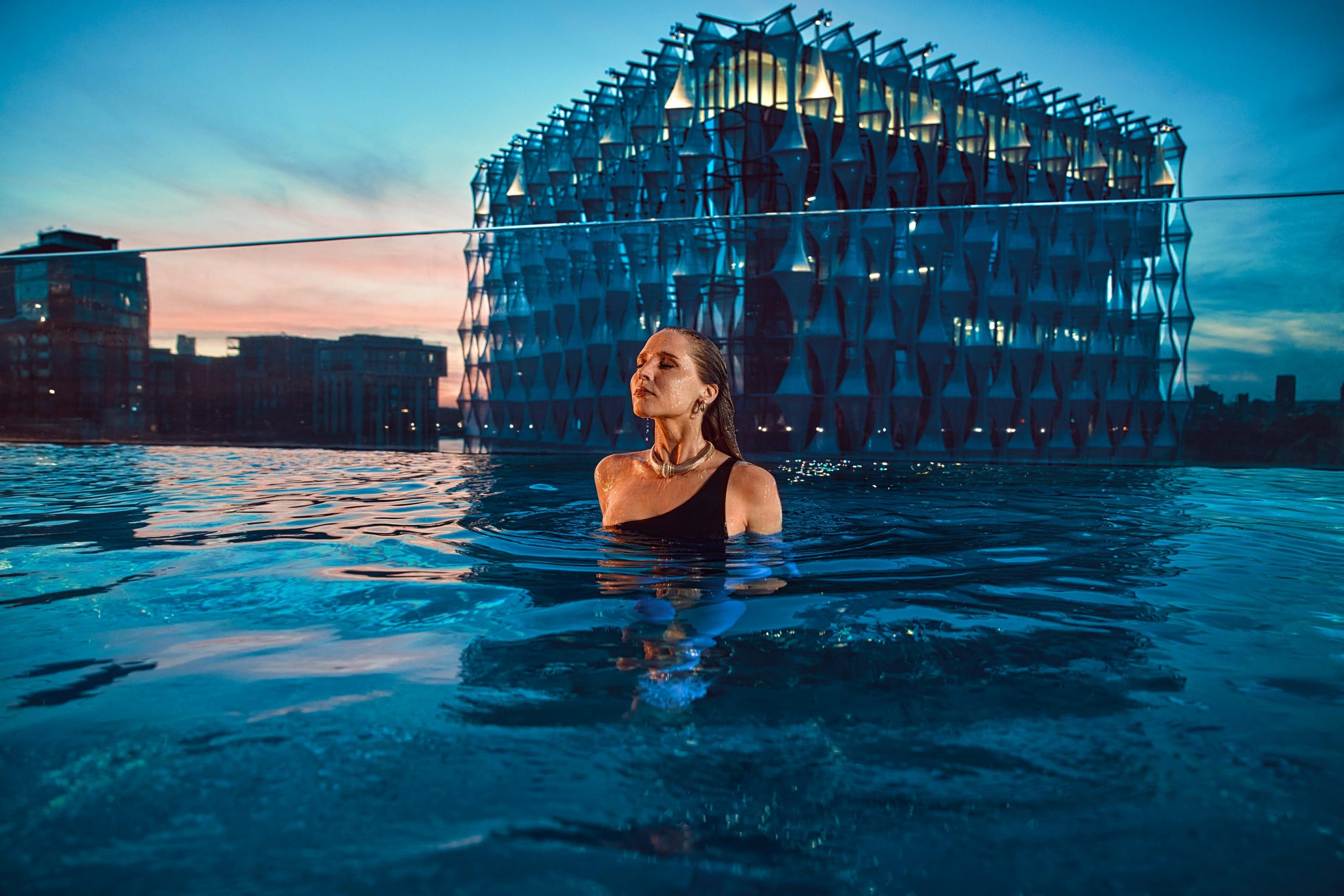 Sky Pool at Embassy Gardens London Woman at Dusk